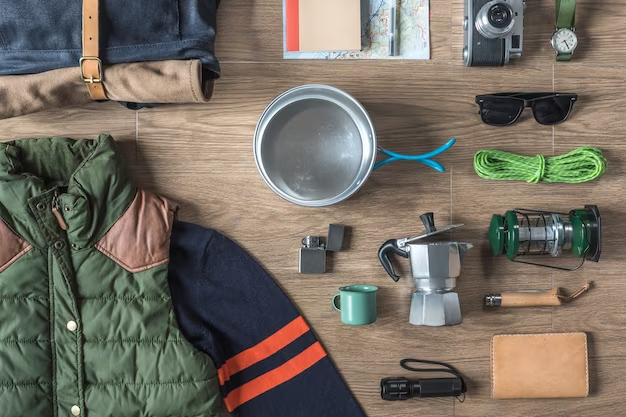 Hiking gear scattered on the ground.