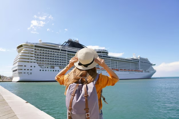 Woman with Hat and Backpack Gazing at Distant Ferry